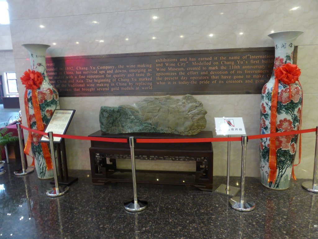 Vases, stone with a relief and information on the ChangYu company, in the main hall of the ChangYu Wine Culture Museum
