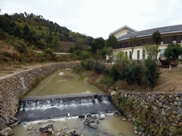 Small river and waterfall just outside the Yongding Scenic Area with the Gaobei Tulou Cluster