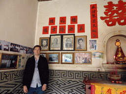 Tim with photos of the founders of the Qiaofu Lou building of the Gaobei Tulou Cluster