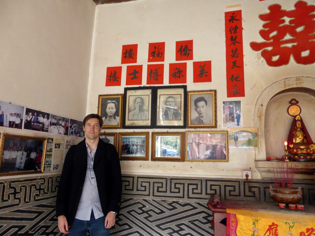 Tim with photos of the founders of the Qiaofu Lou building of the Gaobei Tulou Cluster