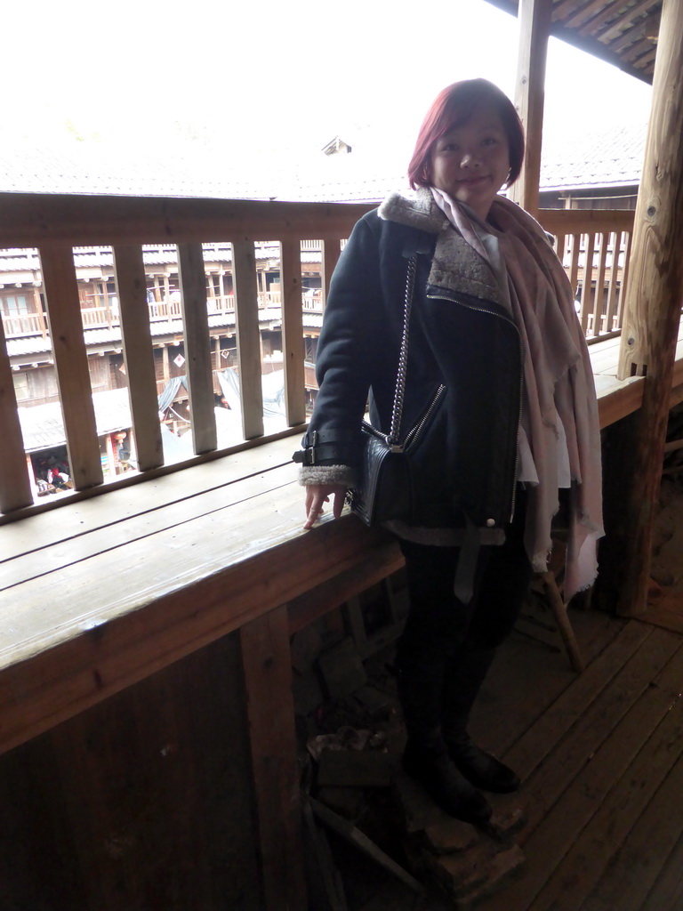 Miaomiao at the top level of the Shize Lou building of the Gaobei Tulou Cluster