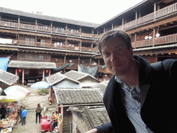Tim at the second level of the Shize Lou building of the Gaobei Tulou Cluster