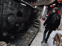 Tim at the outer layer on the ground level of the Chengqi Lou building of the Gaobei Tulou Cluster