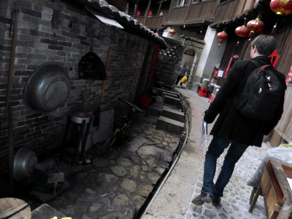 Tim at the outer layer on the ground level of the Chengqi Lou building of the Gaobei Tulou Cluster