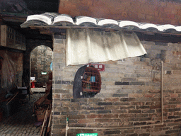 Bird cage at the outer layer on the ground level of the Chengqi Lou building of the Gaobei Tulou Cluster