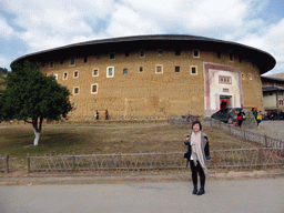 Miaomiao in front of the Chengqi Lou building of the Gaobei Tulou Cluster