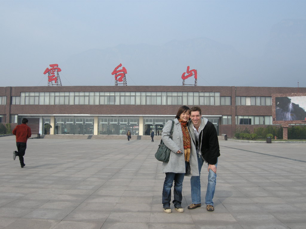 Tim and Miaomiao in front of the entrance to the Mount Yuntaishan Global Geopark