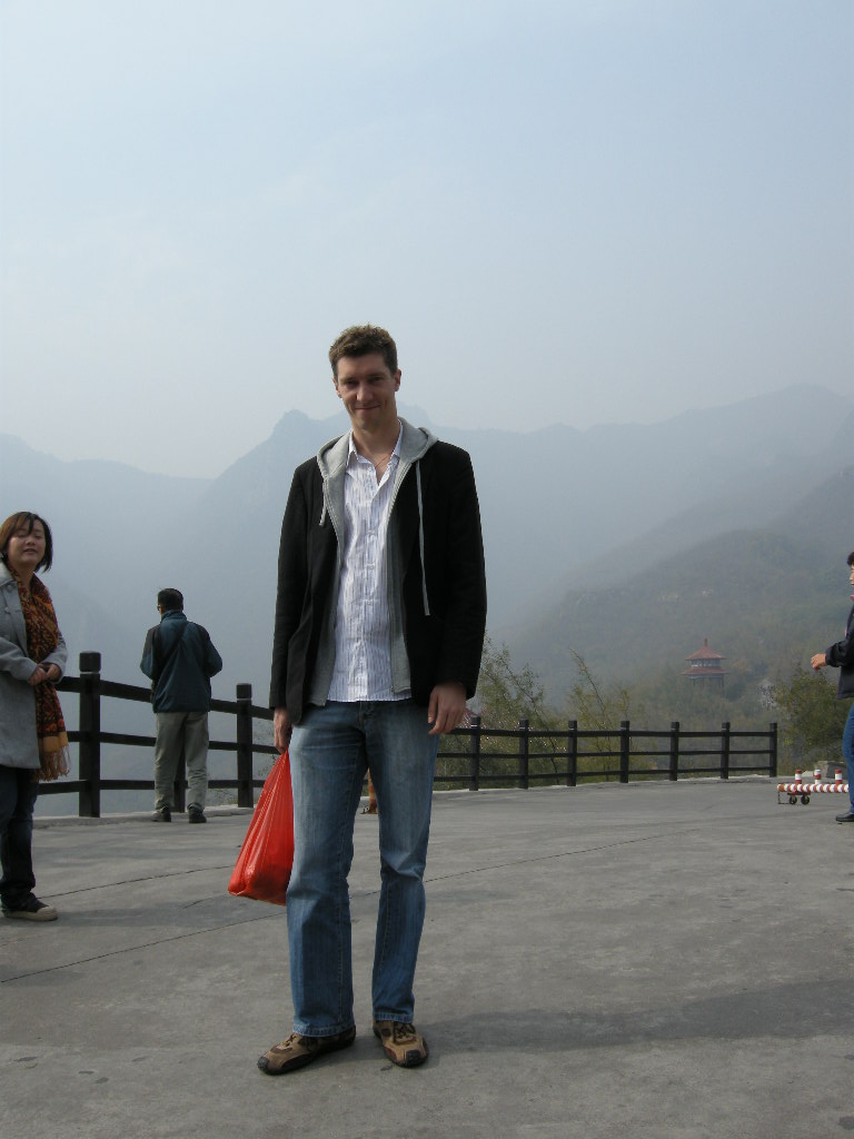 Tim and Miaomiao with mountains at the Mount Yuntaishan Global Geopark