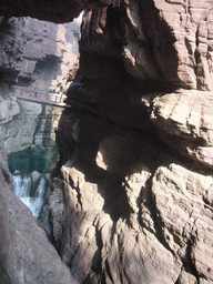 River, waterfall and bridge at the Red Stone Gorge at the Mount Yuntaishan Global Geopark, viewed from the mountainside path