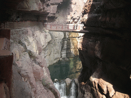 River, waterfall and bridge at the Red Stone Gorge at the Mount Yuntaishan Global Geopark, viewed from the mountainside path