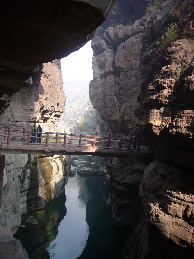 River and bridge at the Red Stone Gorge at the Mount Yuntaishan Global Geopark, viewed from the mountainside path