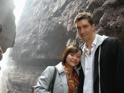 Tim and Miaomiao at the bridge at the Red Stone Gorge at the Mount Yuntaishan Global Geopark, with a view on the mountainside path