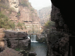 River and bridge over the waterfall at the Red Stone Gorge at the Mount Yuntaishan Global Geopark, viewed from the bridge