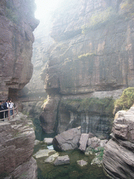 River at the Red Stone Gorge at the Mount Yuntaishan Global Geopark, viewed from the mountainside path