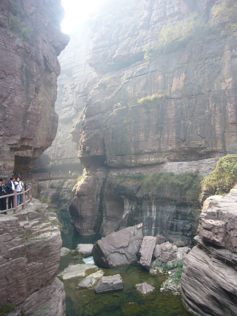 River at the Red Stone Gorge at the Mount Yuntaishan Global Geopark, viewed from the mountainside path