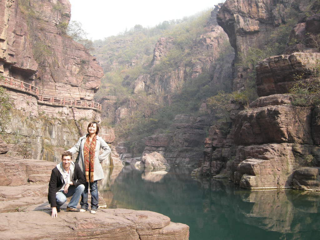Tim and Miaomiao in front of the river at the Red Stone Gorge at the Mount Yuntaishan Global Geopark