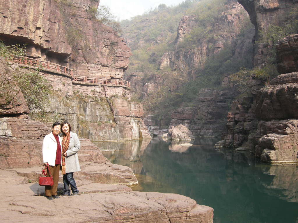Miaomiao and her mother in front of the river at the Red Stone Gorge at the Mount Yuntaishan Global Geopark
