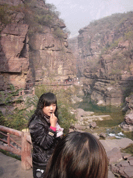 River and mountainside path at the Red Stone Gorge at the Mount Yuntaishan Global Geopark, viewed from the mountainside path