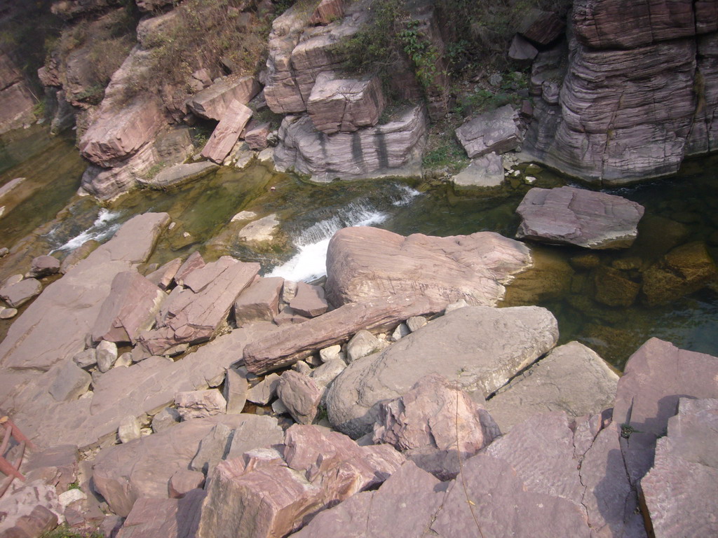 River at the Red Stone Gorge at the Mount Yuntaishan Global Geopark, viewed from the mountainside path