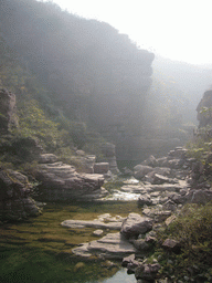 River at the Red Stone Gorge at the Mount Yuntaishan Global Geopark, viewed from the mountainside path