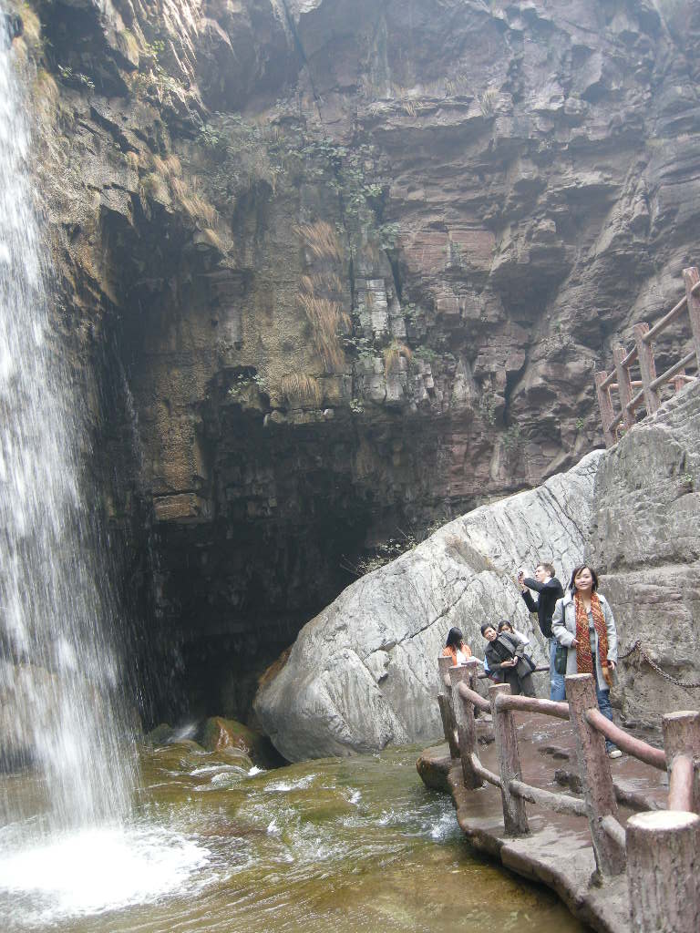 Tim and Miaomiao at the waterfall at the Red Stone Gorge at the Mount Yuntaishan Global Geopark