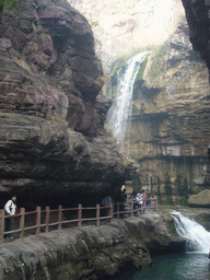 River, waterfalls and mountainside path at the Red Stone Gorge at the Mount Yuntaishan Global Geopark, viewed from the mountainside path