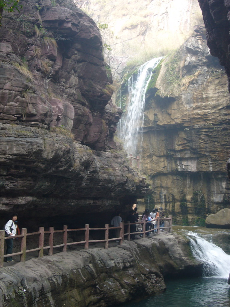 River, waterfalls and mountainside path at the Red Stone Gorge at the Mount Yuntaishan Global Geopark, viewed from the mountainside path