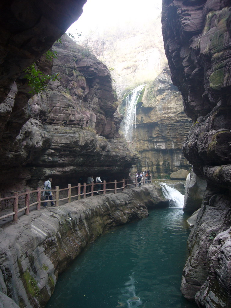 River, waterfalls and mountainside path at the Red Stone Gorge at the Mount Yuntaishan Global Geopark, viewed from the mountainside path