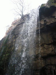 Waterfall at the Red Stone Gorge at the Mount Yuntaishan Global Geopark, viewed from the mountainside path