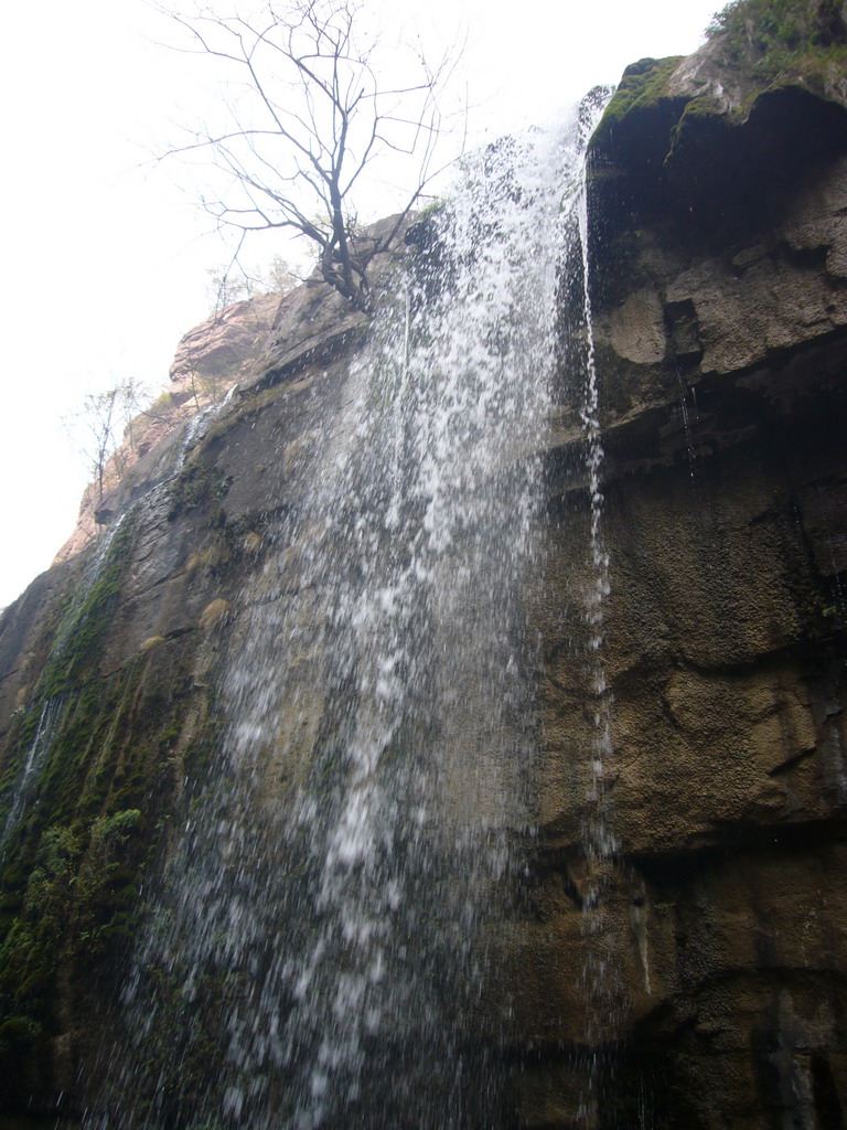 Waterfall at the Red Stone Gorge at the Mount Yuntaishan Global Geopark, viewed from the mountainside path