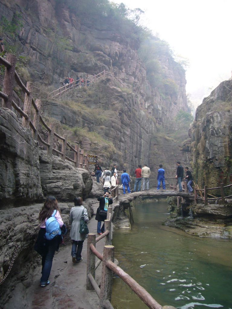 Miaomiao, her mother and her aunt at the path next to the river at the Red Stone Gorge at the Mount Yuntaishan Global Geopark