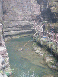 Fisherman at the river at the Red Stone Gorge at the Mount Yuntaishan Global Geopark