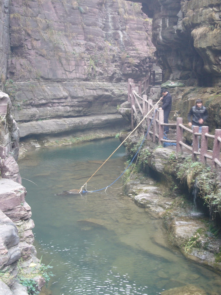 Fisherman at the river at the Red Stone Gorge at the Mount Yuntaishan Global Geopark