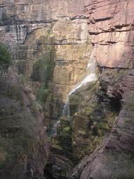 Waterfall at the Red Stone Gorge at the Mount Yuntaishan Global Geopark, viewed from the mountainside path