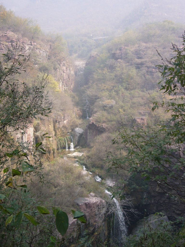 Waterfalls at the Red Stone Gorge at the Mount Yuntaishan Global Geopark, viewed from the mountainside path