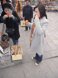 Miaomiao and her aunt eating fruit at the Mount Yuntaishan Global Geopark