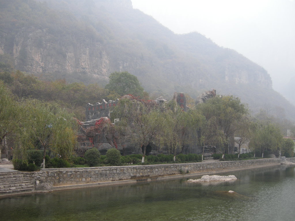 River and rock building at the Tanpu Gorge at the Mount Yuntaishan Global Geopark