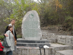 Tim and Miaomiao in front of a rock with inscription at the Tanpu Gorge at the Mount Yuntaishan Global Geopark