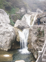 Miaomiao`s aunt at a waterfall at the Tanpu Gorge at the Mount Yuntaishan Global Geopark