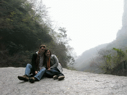 Tim and Miaomiao sitting on a rock at the Longfeng Gorge at the Mount Yuntaishan Global Geopark