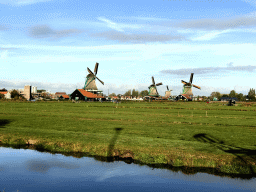 The De Kat, Het Jonge Schaap, De Os and De Zoeker windmills at the Zaanse Schans neighbourhood, viewed from the Schansend street
