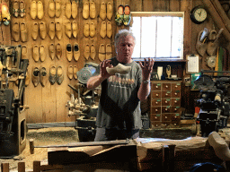 Clogmaker giving a demonstration at the Wooden Shoe Workshop Zaanse Schans at the Zaanse Schans neighbourhood