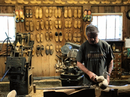 Clogmaker giving a demonstration at the Wooden Shoe Workshop Zaanse Schans at the Zaanse Schans neighbourhood