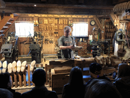 Clogmaker giving a demonstration at the Wooden Shoe Workshop Zaanse Schans at the Zaanse Schans neighbourhood