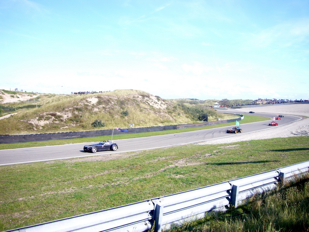 Old race cars with flags at Circuit Zandvoort, during the flag parade of the 2007-08 Dutch A1 Grand Prix of Nations