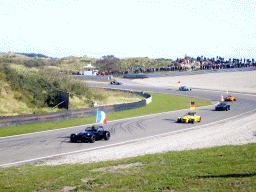 Old race cars with flags at Circuit Zandvoort, during the flag parade of the 2007-08 Dutch A1 Grand Prix of Nations