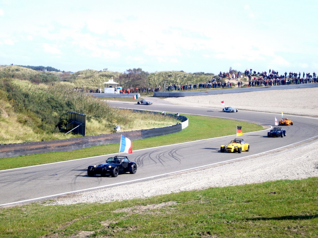 Old race cars with flags at Circuit Zandvoort, during the flag parade of the 2007-08 Dutch A1 Grand Prix of Nations