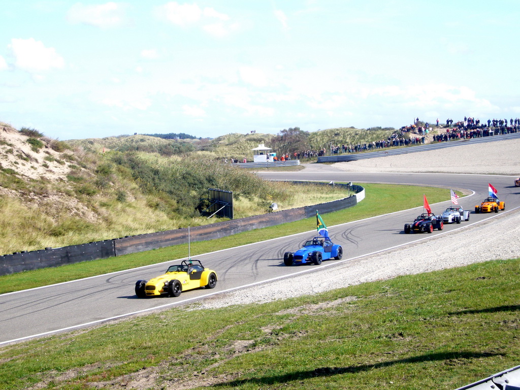 Old race cars with flags at Circuit Zandvoort, during the flag parade of the 2007-08 Dutch A1 Grand Prix of Nations