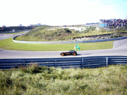 Old race car with Sérgio Jimenez and the Brazilian flag at Circuit Zandvoort, before the Main Race of the 2007-08 Dutch A1 Grand Prix of Nations
