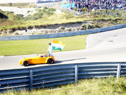 Old race car with Narain Karthikeyan and the Indian flag at Circuit Zandvoort, before the Main Race of the 2007-08 Dutch A1 Grand Prix of Nations